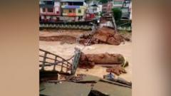 Bridge collapses as floods hit China’s south